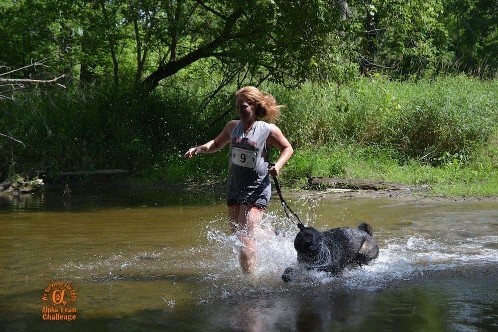 Running with Dog in Creek